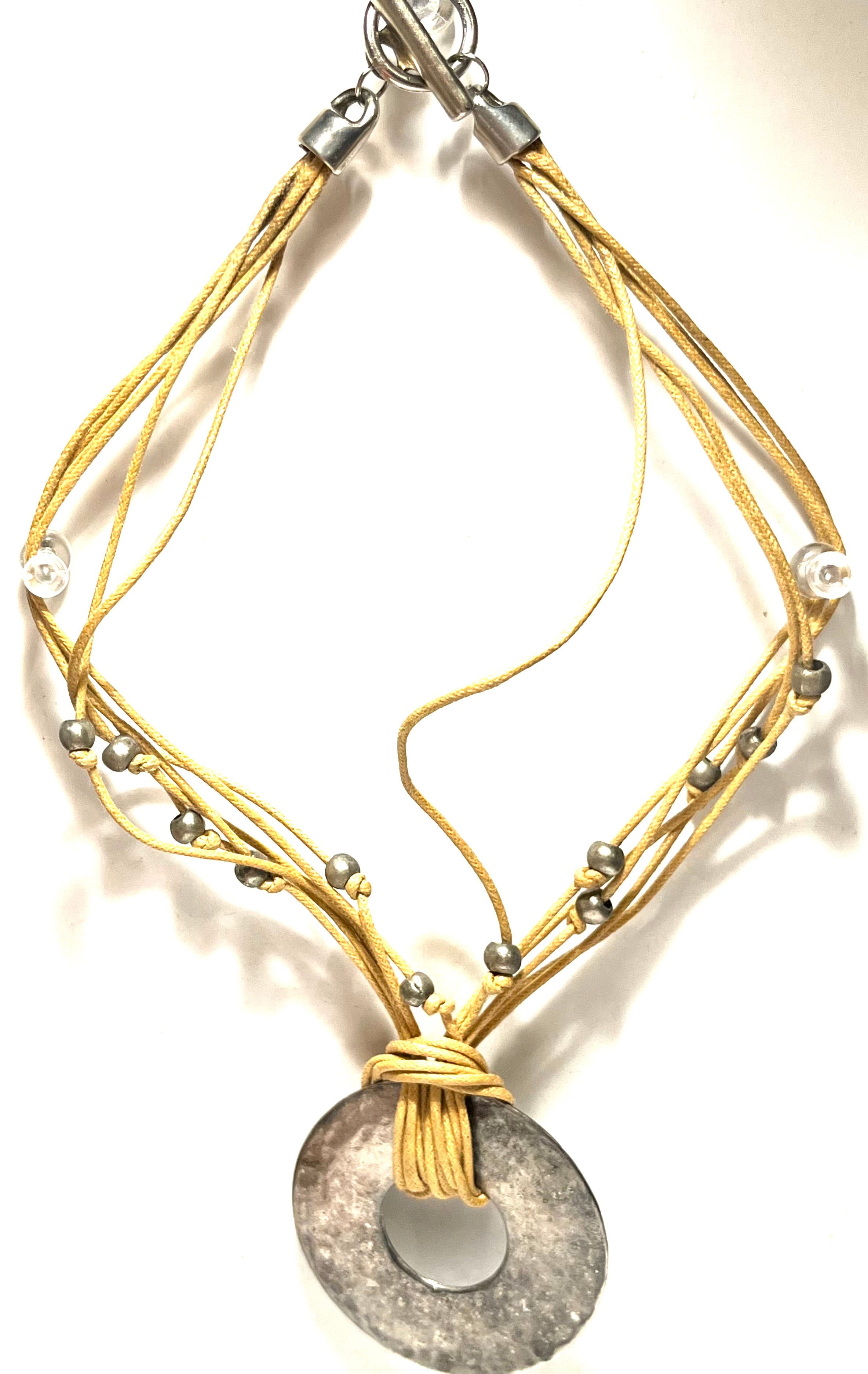 Boho Multi-Strand Cord Necklace with Hammered Silver Tone Donut Pendant